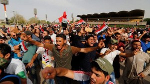 Followers of Iraq's Shi'ite cleric Moqtada al-Sadr shout slogans at Grand Festivities Square within the Green Zone in Baghdad