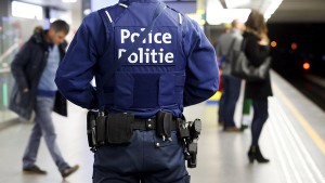 A Belgian police officer patrols in a metro station, a week after bomb attacks in a Brussels metro station and the Belgian international airport of Zaventem, in Brussels, Belgium