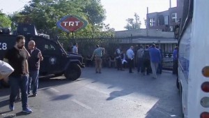 A still image from video shows armoured police vehicle and people waiting outside TRT state television after a failed coup attempt by Turkish soldiers, in Istanbul