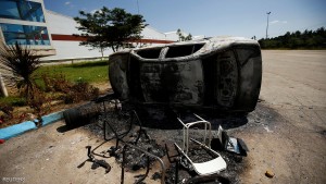 A vehicle that was torched during protests in the compound of a textile factory is seen in the town of Sebeta, Oromia region, Ethiopia
