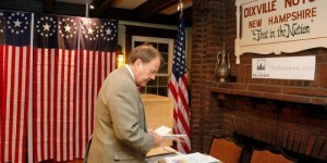 Town Moderator Tom Tillotson arrives with the ballots in preparation for the first U.S. voters to cast their votes in the U.S. presidential election at midnight in tiny Dixville Notch