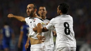 Iraq's Justin Meram celebrates with teammate Ali Fesny Faisal after scoring against Thailand during their 2018 World Cup qualifying soccer match at Rajamangala National Stadium in Bangkok