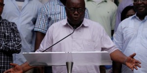 Ghanaian presidential candidate Nana Akufo-Addo of the NPP gestures during a press conference at his private home in Accra