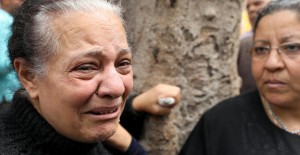 A relative of one of the victims reacts after a church explosion killed at least 21 in Tanta,