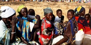 Women and children wait to be registered prior to a food distribution carried out by the United Nations World Food Programme (WFP) in Thonyor, Leer state, South Sudan