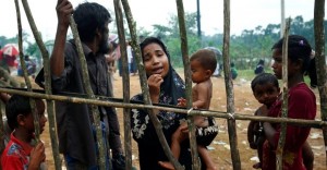 A new Rohingya refugee woman cries as they arrive near the Kutupalang makeshift Refugee Camp, in Cox’s Bazar