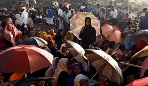 Rohingya refugees wait for humanitarian aid to be distributed at the Balukhali refugee camp in Cox's Bazar