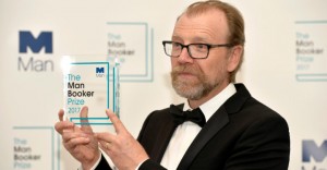 George Saunders, author of 'Lincoln in the Bardo', poses for photographers after winning the Man Booker Prize for Fiction 2017 in London