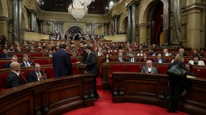 Catalan President Puigdemont takes his seat before a session at the Catalan regional Parliament in Barcelona