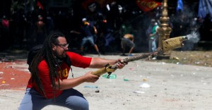 Demonstrators clash with police as lawmakers debate a pension reform measure, in Buenos Aires