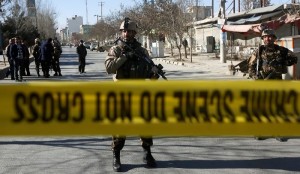 Afghan security forces keep watch at the site of a suicide attack in Kabul