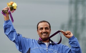 Bronze medallist Kuwait's Fehaid Aldeehani poses at the men's trap shooting victory ceremony at the London 2012 Olympic Games at the Royal Artillery Barracks