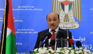 Palestinian Minister of public works and housing, Mufid al-Hasayna speaks during a press conference