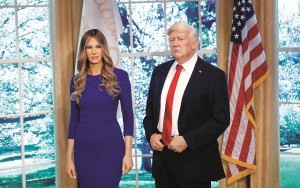 A newly unveiled wax figure of first lady Melania Trump stands next to a wax figure of her husband U.S. President Donald Trump at Madame Tussauds in New York City