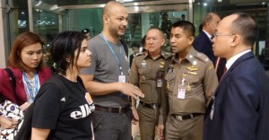 Saudi teen Rahaf Mohammed al-Qunun is seen with Thai immigration authorities at a hotel inside Suvarnabhumi Airport in Bangkok